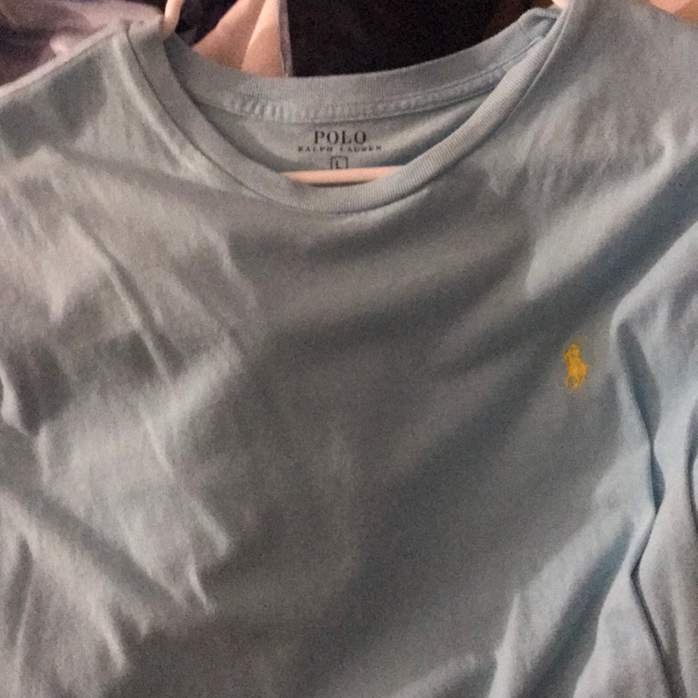 A light blue and yellow polo tee shirt